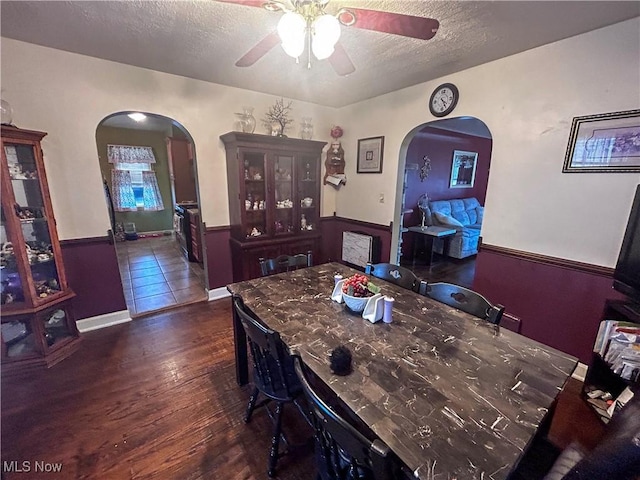 76 Parkgate Ave, Youngstown, OH 44515 - dining room featuring arched walkways, ceiling fan, a textured ceiling, and wood finished floors