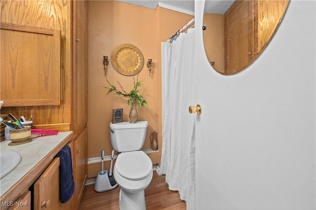 6610 Lear Nagle Rd Unit 26, North Ridgeville, OH 44039 - full bath featuring wood finished floors, vanity, toilet, and curtained shower