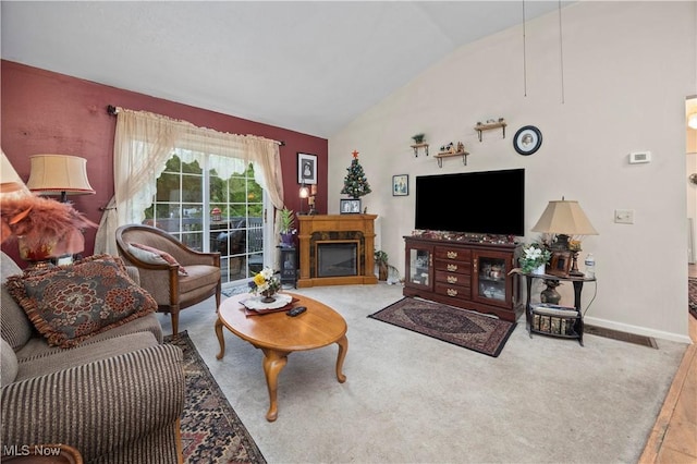 6610 Lear Nagle Rd Unit 26, North Ridgeville, OH 44039 - living area with vaulted ceiling, a fireplace, and baseboards