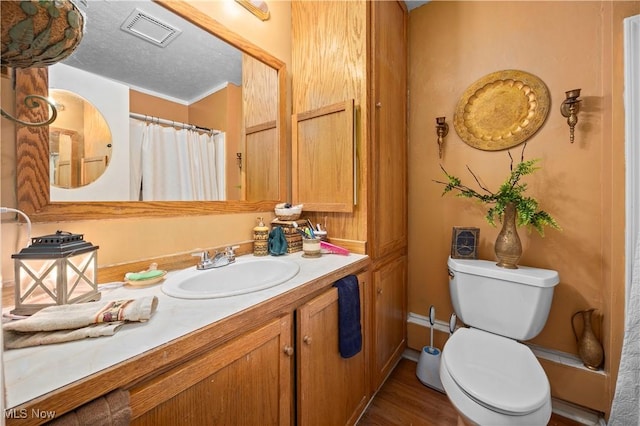 6610 Lear Nagle Rd Unit 26, North Ridgeville, OH 44039 - full bathroom featuring vanity, toilet, and wood finished floors
