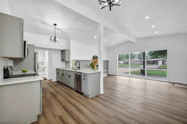 6482 Sherborn Rd, Parma Heights, OH 44130 - kitchen featuring gray cabinets, appliances with stainless steel finishes, a sink, tasteful backsplash, and a chandelier