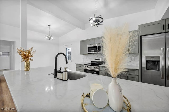 6482 Sherborn Rd, Parma Heights, OH 44130 - kitchen with appliances with stainless steel finishes, a chandelier, a sink, and gray cabinets