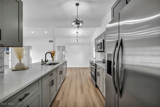 6482 Sherborn Rd, Parma Heights, OH 44130 - kitchen with stainless steel appliances, a sink, light wood-style flooring, gray cabinetry, and recessed lighting