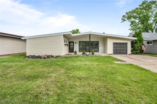 6482 Sherborn Rd, Parma Heights, OH 44130 - mid-century modern home featuring an attached garage, driveway, and a front yard