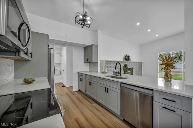 6482 Sherborn Rd, Parma Heights, OH 44130 - kitchen featuring appliances with stainless steel finishes, a sink, gray cabinetry, and recessed lighting