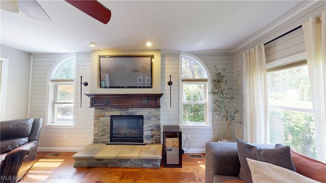 3130 Hollybrook Ln, Mogadore, OH 44260 - living area with wood finished floors and a stone fireplace