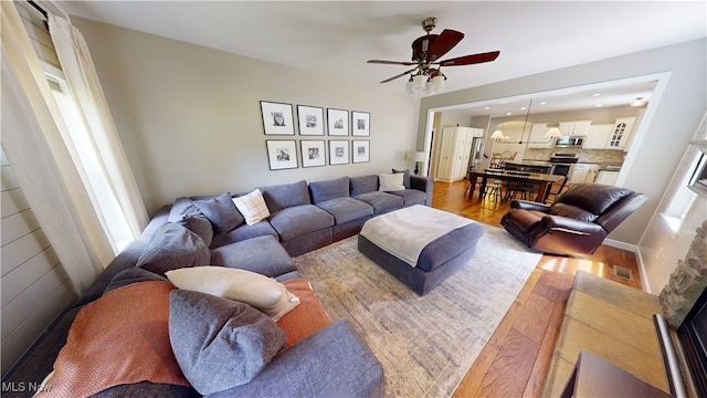 3130 Hollybrook Ln, Mogadore, OH 44260 - living area featuring a ceiling fan, wood finished floors, and recessed lighting