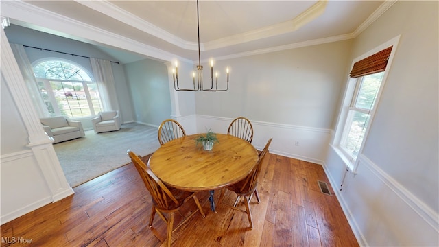 3130 Hollybrook Ln, Mogadore, OH 44260 - dining room with a chandelier, wood-type flooring, baseboards, ornamental molding, and a raised ceiling