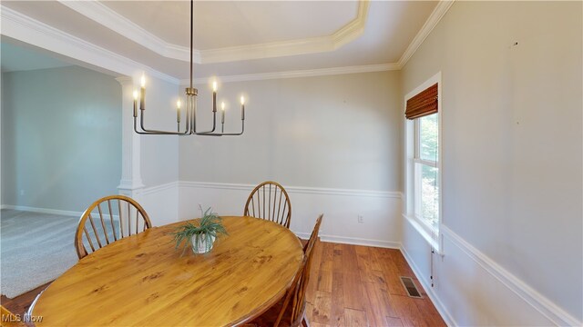 3130 Hollybrook Ln, Mogadore, OH 44260 - dining room with a chandelier, ornamental molding, wood-type flooring, a tray ceiling, and baseboards