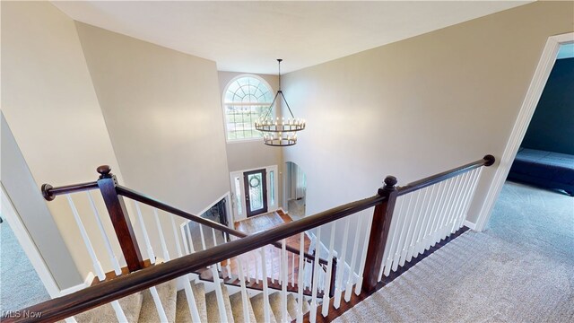 3130 Hollybrook Ln, Mogadore, OH 44260 - stairs with carpet, a chandelier, and baseboards