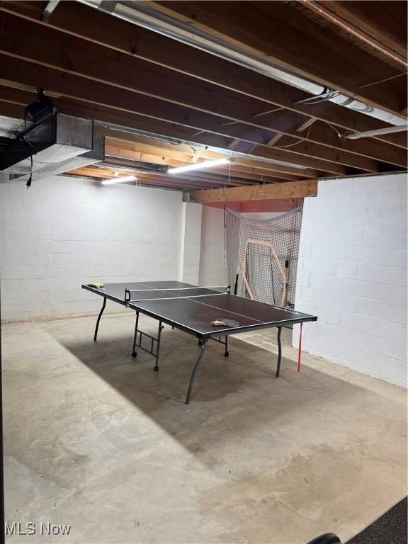 3130 Hollybrook Ln, Mogadore, OH 44260 - rec room with unfinished concrete flooring and concrete block wall