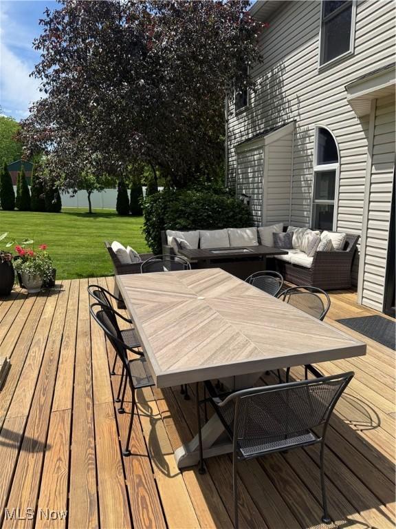 3130 Hollybrook Ln, Mogadore, OH 44260 - wooden deck with a yard, outdoor dining area, and an outdoor living space
