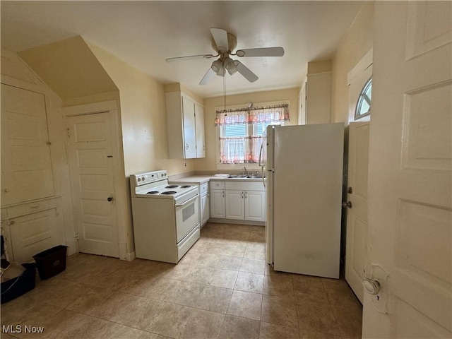 1733 E 47th St, Ashtabula, OH 44004 - kitchen with white appliances, a sink, white cabinets, a ceiling fan, and light tile patterned flooring