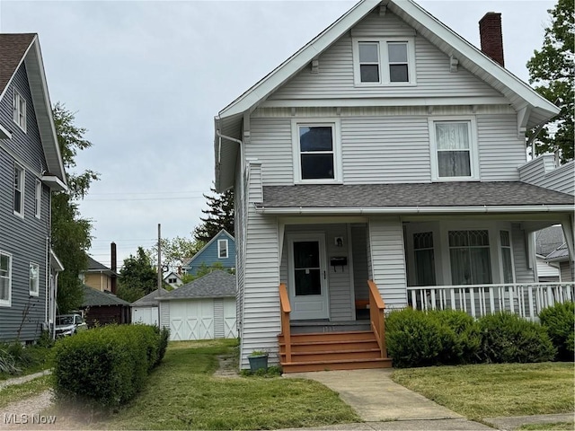 1733 E 47th St, Ashtabula, OH 44004 - view of front of property featuring a chimney, covered porch, a front lawn, and a garage