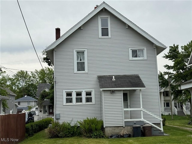 1733 E 47th St, Ashtabula, OH 44004 - rear view of property featuring a chimney