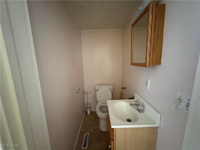 1733 E 47th St, Ashtabula, OH 44004 - bathroom featuring toilet, vanity, baseboards, and tile patterned flooring