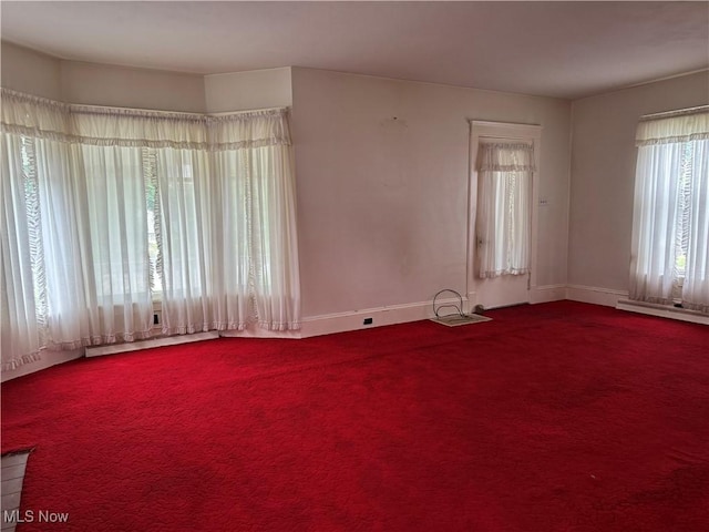 1733 E 47th St, Ashtabula, OH 44004 - empty room with baseboards, carpet flooring, baseboard heating, and a baseboard radiator
