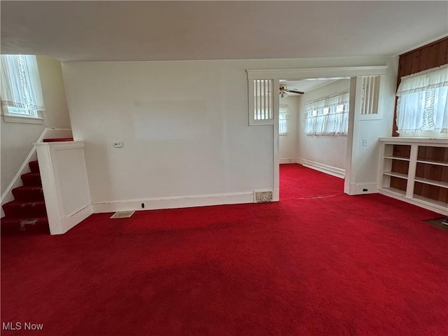 1733 E 47th St, Ashtabula, OH 44004 - unfurnished living room featuring carpet flooring, stairway, ceiling fan, and baseboards