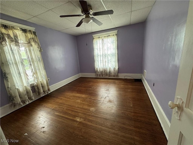 1733 E 47th St, Ashtabula, OH 44004 - unfurnished room with a paneled ceiling, ceiling fan, wood finished floors, and baseboards
