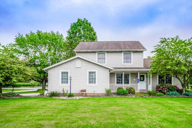1632 Schneider St NW, North Canton, OH 44720 - traditional home with a porch and a front lawn