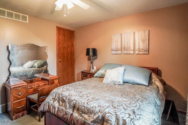 1632 Schneider St NW, North Canton, OH 44720 - carpeted bedroom with a ceiling fan