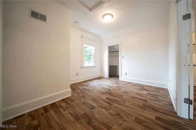 113 Lincoln Ct, Elyria, OH 44035 - unfurnished bedroom with baseboards, dark wood finished floors, and a closet
