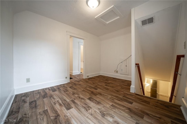 113 Lincoln Ct, Elyria, OH 44035 - unfurnished room with attic access, wood finished floors, and baseboards