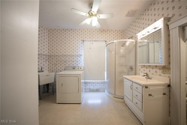 113 Lincoln Ct, Elyria, OH 44035 - bathroom with washer / dryer, wallpapered walls, ceiling fan, a shower stall, and vanity