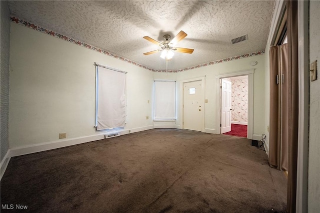 113 Lincoln Ct, Elyria, OH 44035 - empty room with a ceiling fan, baseboards, a textured ceiling, and dark colored carpet