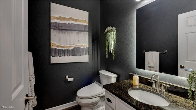 284 Kaylee Dr, Wadsworth, OH 44281 - half bath with a textured wall, vanity, toilet, and baseboards