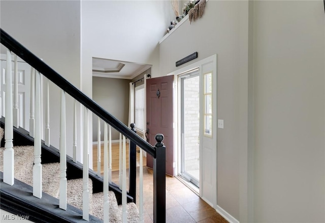 284 Kaylee Dr, Wadsworth, OH 44281 - tiled entryway with stairs, crown molding, and baseboards