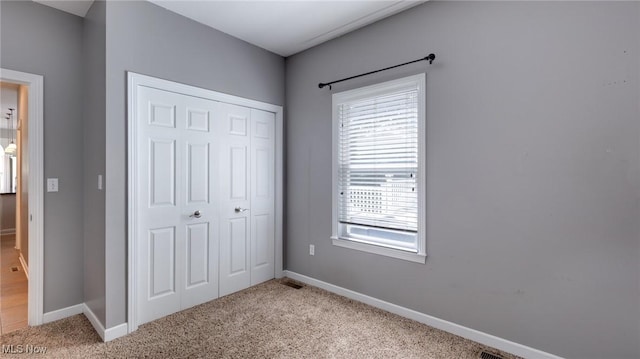 284 Kaylee Dr, Wadsworth, OH 44281 - unfurnished bedroom featuring a closet, light colored carpet, and baseboards