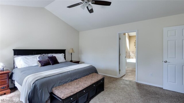284 Kaylee Dr, Wadsworth, OH 44281 - bedroom with lofted ceiling, light carpet, baseboards, a ceiling fan, and ensuite bathroom