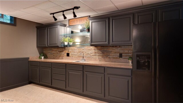 284 Kaylee Dr, Wadsworth, OH 44281 - kitchen with black fridge with ice dispenser, a sink, gray cabinets, track lighting, and a paneled ceiling