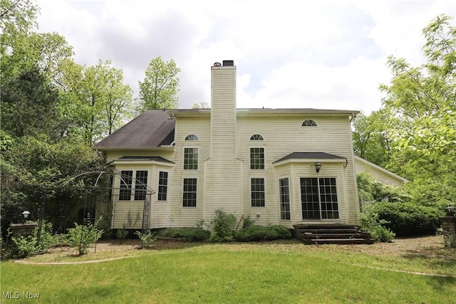 5280 Kapok Dr, Medina, OH 44256 - back of property featuring a chimney and a yard