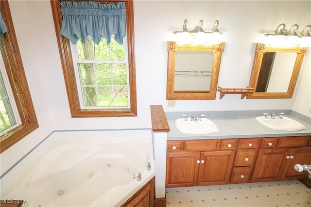 5280 Kapok Dr, Medina, OH 44256 - bathroom with double vanity and a jetted tub