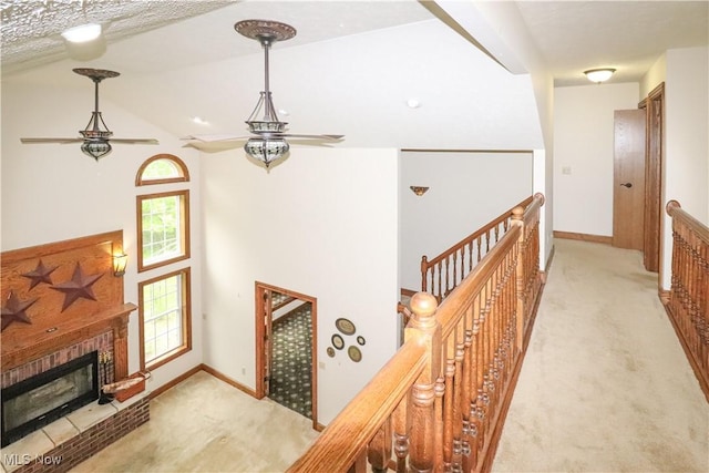 5280 Kapok Dr, Medina, OH 44256 - corridor featuring carpet floors, an upstairs landing, baseboards, and high vaulted ceiling