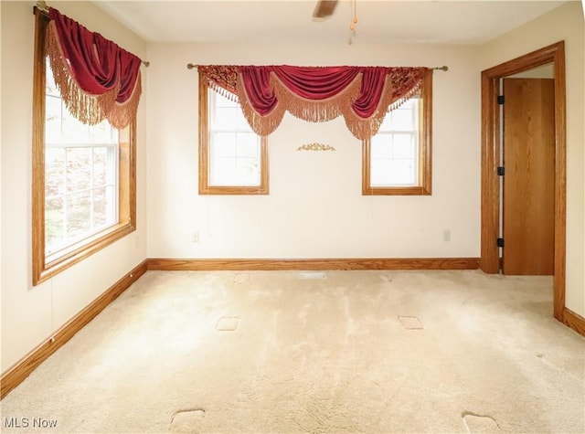 5280 Kapok Dr, Medina, OH 44256 - carpeted spare room featuring plenty of natural light, baseboards, and a ceiling fan