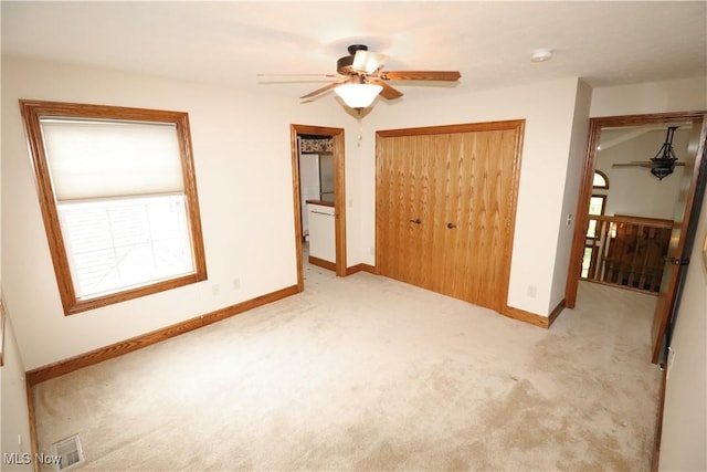 5280 Kapok Dr, Medina, OH 44256 - unfurnished bedroom with carpet, a closet, baseboards, and ceiling fan