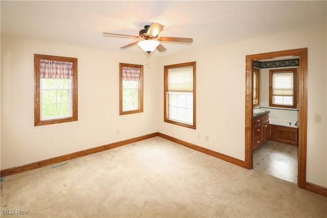 5280 Kapok Dr, Medina, OH 44256 - unfurnished room featuring light carpet, baseboards, and a ceiling fan