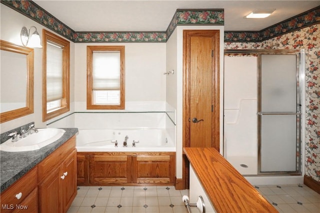 5280 Kapok Dr, Medina, OH 44256 - full bath with a shower stall, vanity, a bath, wallpapered walls, and tile patterned flooring