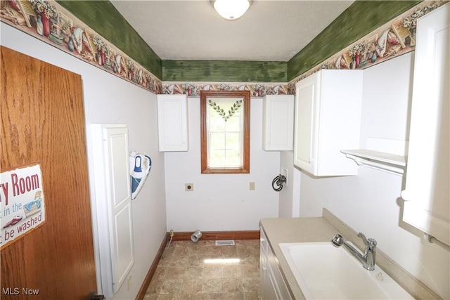 5280 Kapok Dr, Medina, OH 44256 - laundry room featuring baseboards, cabinet space, and electric dryer hookup