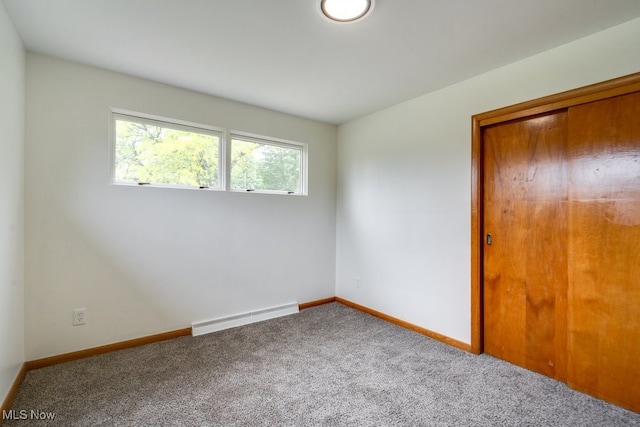 1924 Tiffany Dr NE, Warren, OH 44483 - carpeted spare room with a baseboard heating unit and baseboards