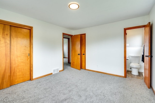 1924 Tiffany Dr NE, Warren, OH 44483 - unfurnished bedroom with carpet floors, baseboards, and ensuite bathroom