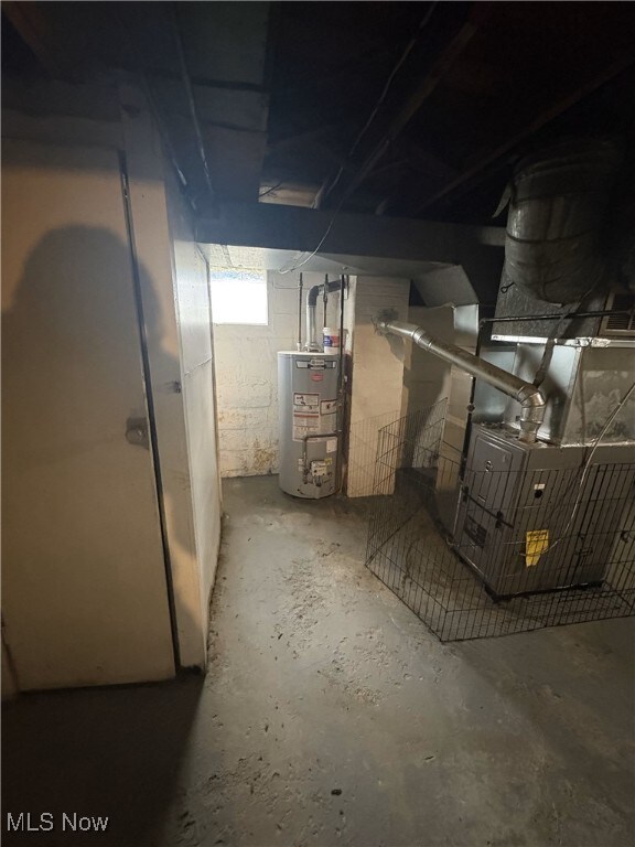369 Montrose Ave, Akron, OH 44310 - basement featuring water heater and heating unit