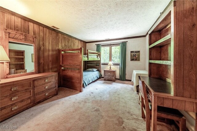 10576 Hemlock Ridge Dr, Chardon, OH 44024 - bedroom with wooden walls, light colored carpet, ornamental molding, and a textured ceiling