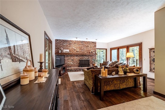 10576 Hemlock Ridge Dr, Chardon, OH 44024 - living area featuring dark wood-type flooring, a textured ceiling, a brick fireplace, and brick wall