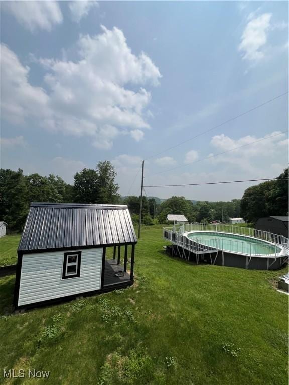 26938 County Rd 1, Coshocton, OH 43812 - view of green lawn featuring an outdoor pool and an outdoor structure
