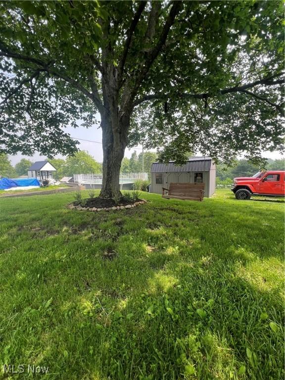 26938 County Rd 1, Coshocton, OH 43812 - view of green lawn featuring a storage shed