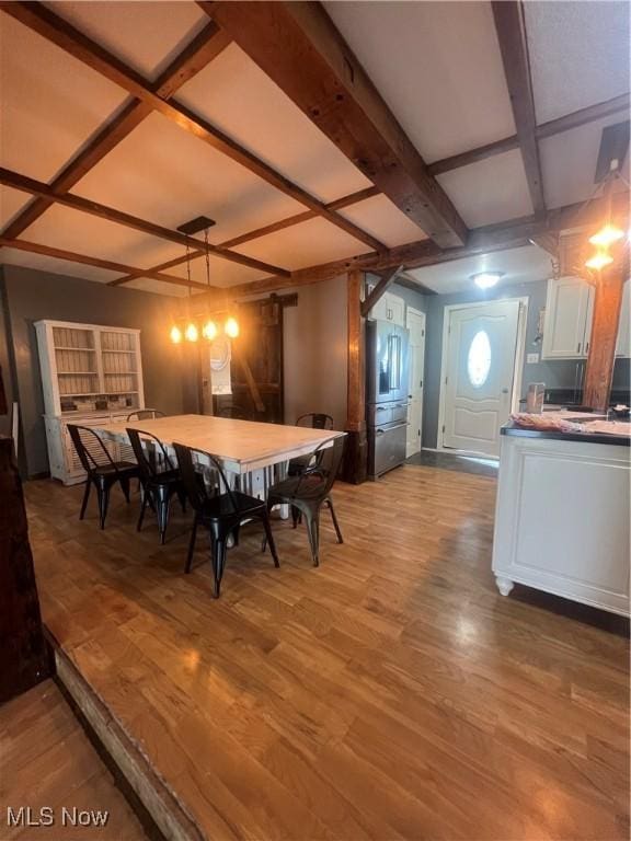 26938 County Rd 1, Coshocton, OH 43812 - dining area featuring coffered ceiling, wood finished floors, and beam ceiling